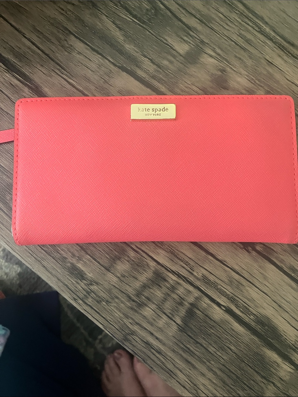 kate spade coral zip-around wallet with gold logo
